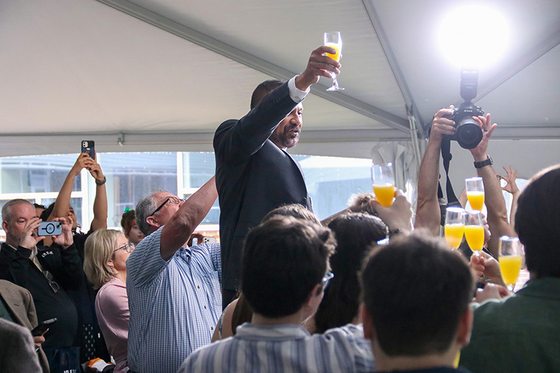 Following VIMS tradition, Siddhartha Mitra toasts the graduates during a reception following the Diploma Ceremony. Photo by John Wallace